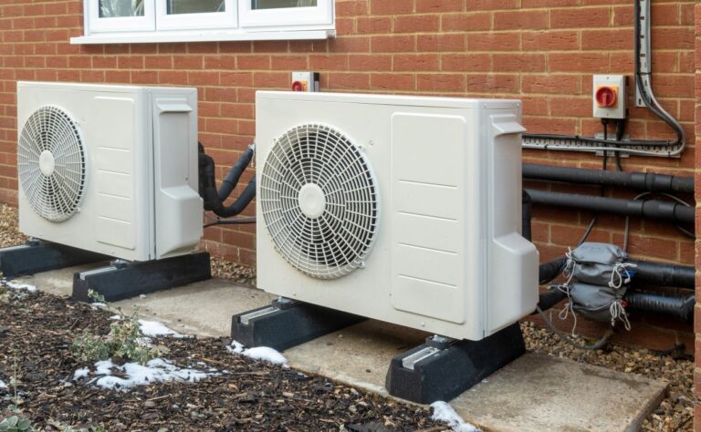 Air source heat pump installation on a modern house