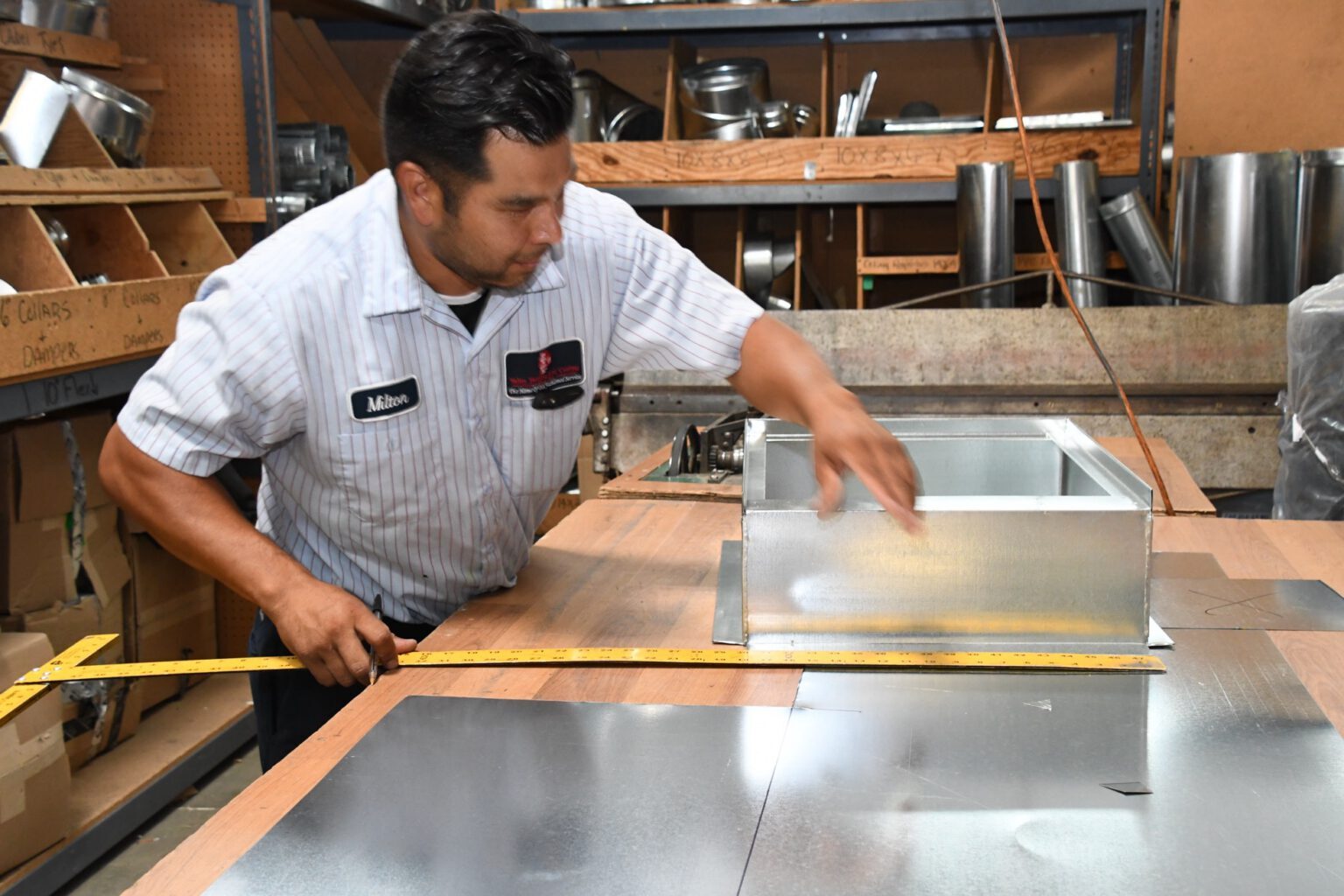 Valley Heating sheet metal technician fabricating ductwork in the shop