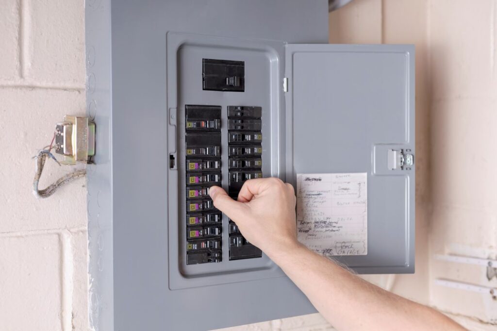 Turning on power at the electrical service panel. Resetting tripped circuit breaker