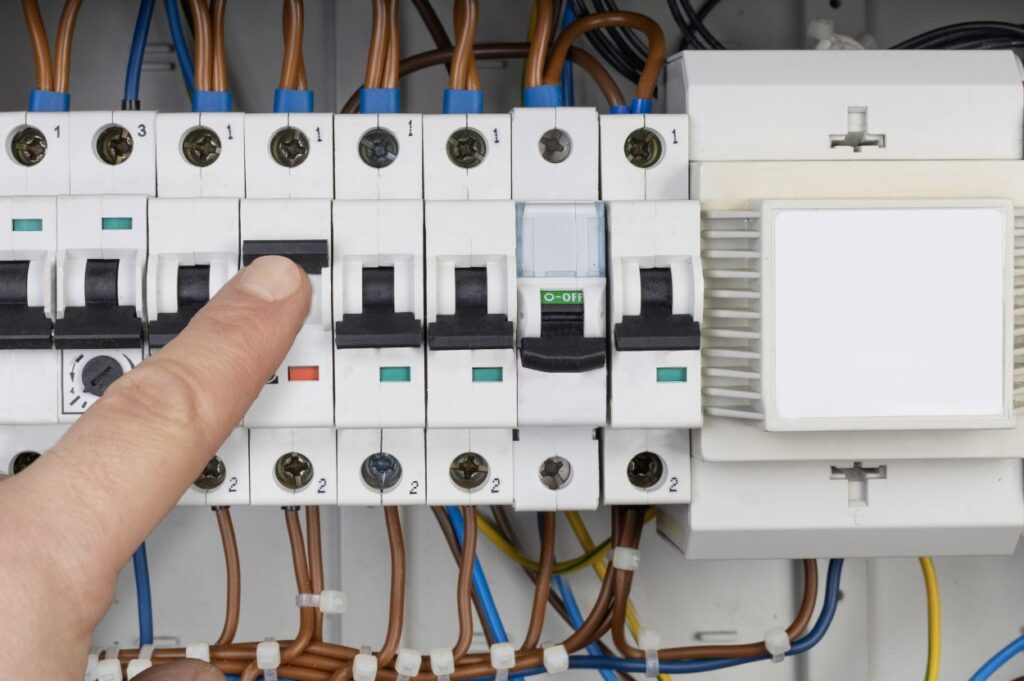 Electrician Testing Circuit Breaker Panel